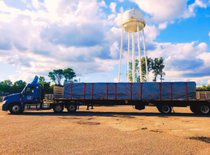 While the company's primary focus is dry van freight, Acosta keeps the fleet's options open with a flatbed trailer, shown here hooked to the company's 2012 Freightliner Cascadia, and a walking floor trailer.